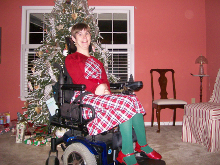 Brantley in front of tree and gifts Christmas Eve 2009