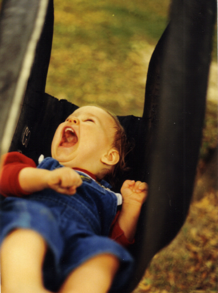 Brantley swinging in tire swing 1987