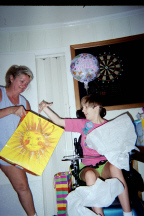 Connie helping Brantley open birthday gift 2003 Thumbnail