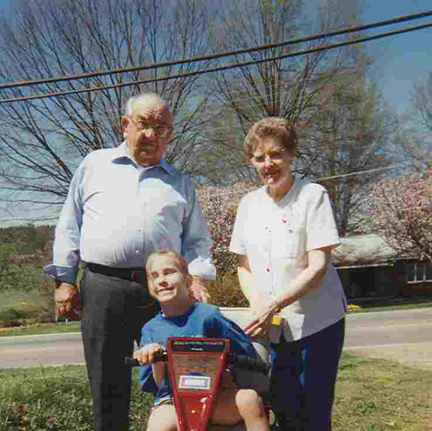Grandmaw, Grandpa, and Brantley on Scooter 1998