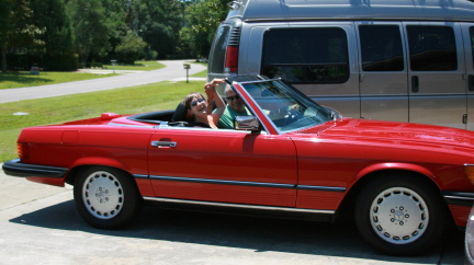 Brantley and Eddie waiving in cruiser 8-1-0904